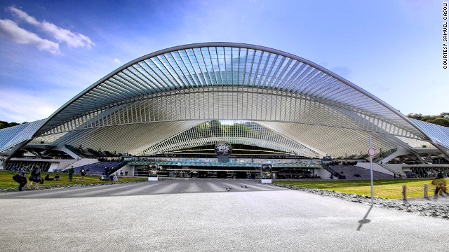The Liege-Guillemin station in Liege, Belgium features an ultra-modern glass and steel facade. The wave-like ribbed roof suggests movement over the thousands of commuters that flow under it daily.