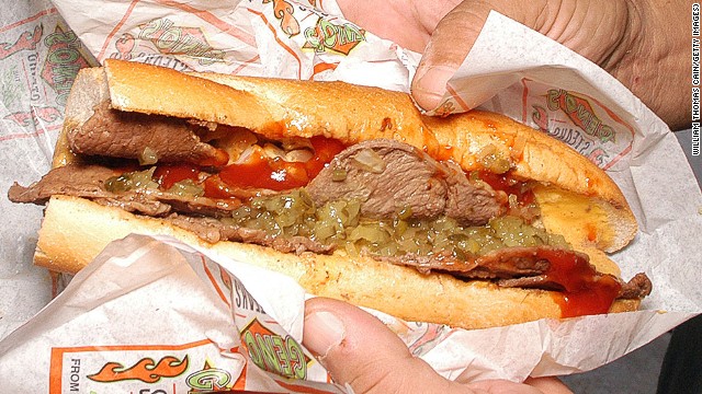The cheesesteak (this one from Geno's Steaks) is a Philadelphia staple. Another is scrapple: pig trimmings in cornmeal and flour formed into a loaf. Slice and pan-fry until all you can taste is heart surgery.
