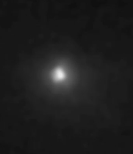 Screen dump from the video of a NASA broadcast about the very close pass by Mars of the comet C/2013 A1 Siding Spring. A fully resolved image of Comet Siding Spring nucleus in crescent phase as seen by MRO HiRISE. Image via NASA/JPL/University of Arizona.