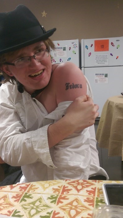 fedora,poorly dressed,tattoos,g rated