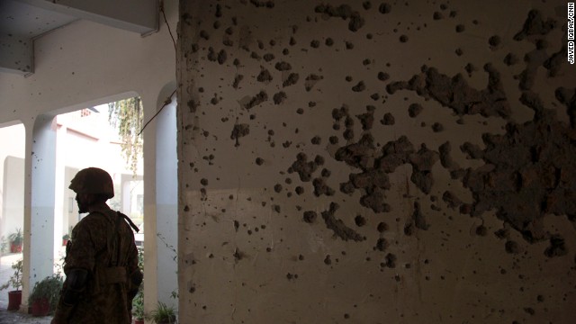 Bullet holes litter the walls of the school. 