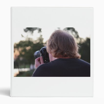 photographer taking picture male back of head 3 ring binder