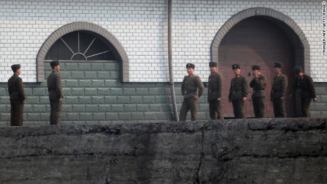 North Korean soldiers gather by the docks in Sinuiju, near the Chinese border, in April 2013.