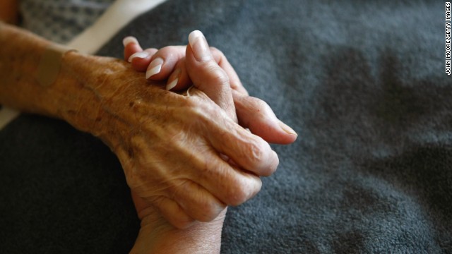 A terminally ill resident of a Colorado hospice is comforted. In hospice care, dying people are kept comfortable without extreme medical intervention.