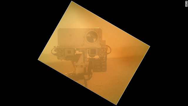 The Curiosity rover used a camera located on its arm to obtain this self-portrait on September 7, 2012. The image of the top of Curiosity's Remote Sensing Mast, showing the Mastcam and Chemcam cameras, was taken by the Mars Hand Lens Imager. The angle of the frame reflects the position of the MAHLI camera on the arm when the image was taken.