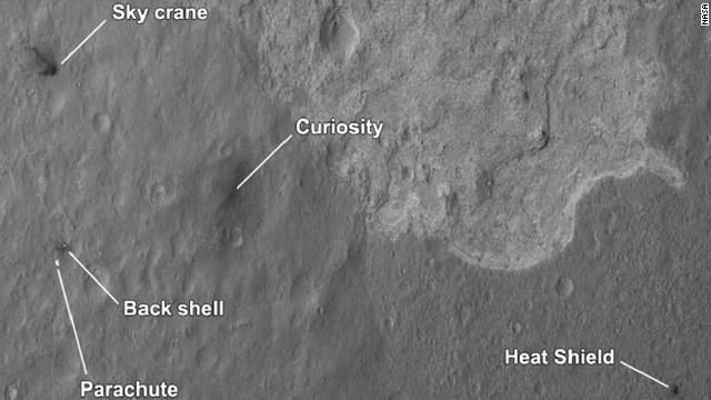 The four main pieces of hardware that arrived on Mars with NASA's Curiosity rover were spotted by NASA's Mars Reconnaissance Orbiter. The High-Resolution Imaging Science Experiment camera captured this image about 24 hours after landing. 