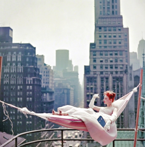 Gwen Verdon in a hammock wearing a ballgown for the Look...