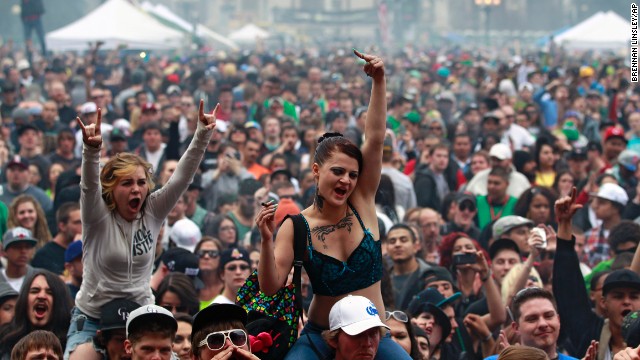 Members of a crowd numbering tens of thousands smoke and listen to live music at the Denver 420 Rally on April 20. <a href='http://ift.tt/11rzBdC'>Annual festivals celebrating marijuana</a> are held around the world on April 20, a counterculture holiday.