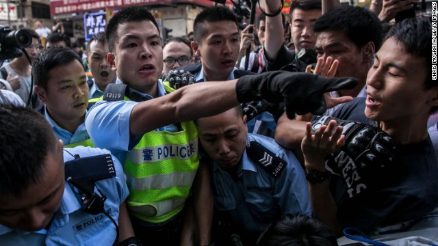 Police clash with protesters as they try to clear a major protest site on Tuesday, November 25. 