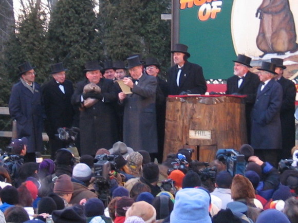 ... the great weather prognosticator, His Majesty, the Punxsutawney Groundhog. See Phil on the far left? Image via Wikimedia Commons.