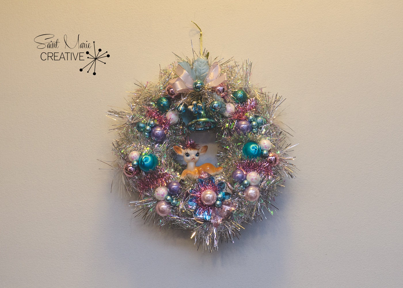 One of my mini creations! This 10" wreath in pinks and blues. Lovely little vintage deer and baby blue vintage corsage.