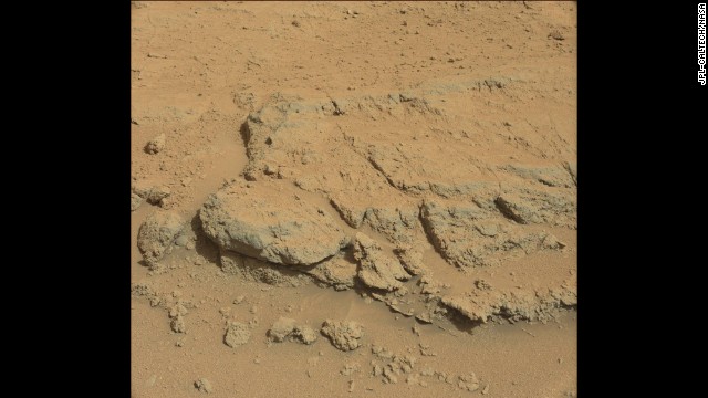 The Curiosity rover took this image on September 10 of a rock formation informally dubbed "Darwin," first noted from the orbiting spacecraft. Scientists had the rover stop in this region, called Waypoint 1, because it appears to be a prime area to study the inner makeup and history of the floor of the Gale Crater. Analysis of Darwin may provide evidence of whether and how water played a role in the layering of rocks in this region.