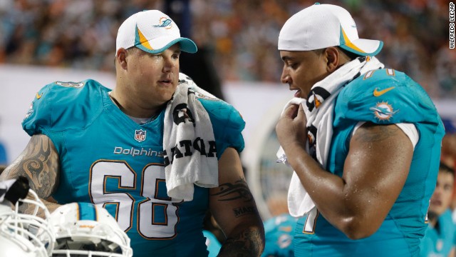 Incognito and Martin talk on the sideline during the second half of a preseason game August 24.