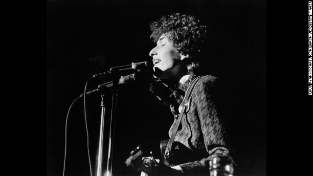 Dylan performs on stage in the 1960s. Dylan was known in his early career for playing the guitar and the harmonica, and for his distinctive vocal phrasing.