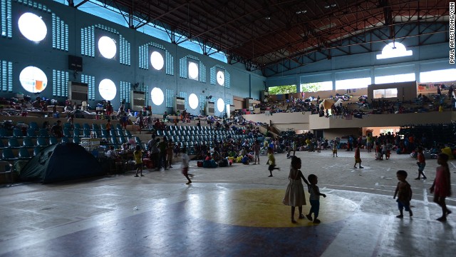 Many in Tacloban have sought shelter in more solid buildings, such as school halls, as a major typhoon threatens the town -- tragically familiar with devastating weather.