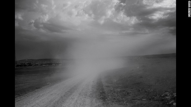Dust rises from the road on the Syrian border.