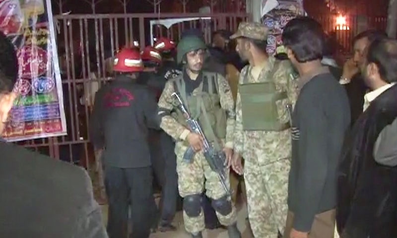 Security personnel gather outside the Rawalpindi imambargah. - DawnNews screengrab
