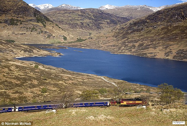 The train journey takes visitors to the picturesque Loch Lomond and Loch Treig (seen here)