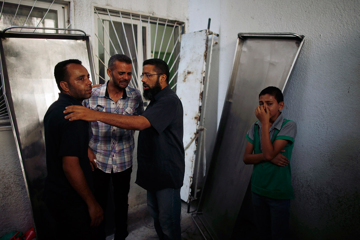 The relatives of an Islamic Jihad militant from the Abu Nada family, killed in an Israeli air strike, mourn at a hospital morgue in the northern Gaza Strip