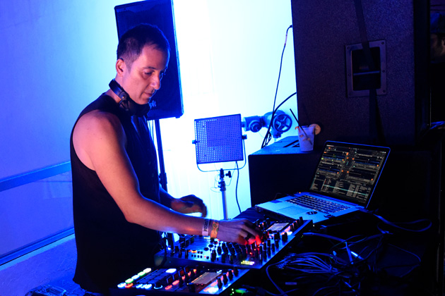 A DJ mixes at Native Instruments' WMC 2015 event