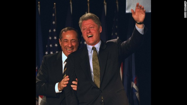 President Bill Clinton waves from the stage with Coumo at the Sheraton New York on October 19, 1994. 