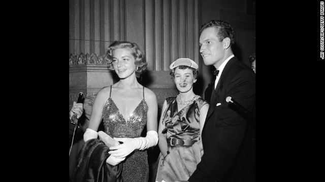 In 1954, Bacall and actor Charlton Heston attend the film premiere of "A Star Is Born."