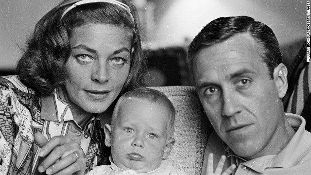 Bacall poses with her second husband, actor Jason Robards, and their baby son Sam in 1962.