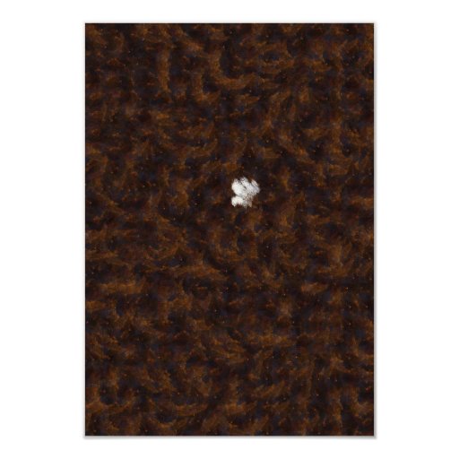A patch of white surrounded by brown 3.5x5 paper invitation card