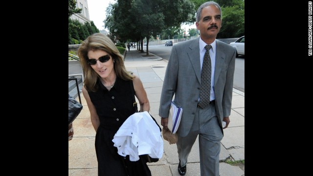 Holder walks with Caroline Kennedy, daughter of former President John F. Kennedy, in June 2008 after they were tasked with searching for a running mate for Obama.