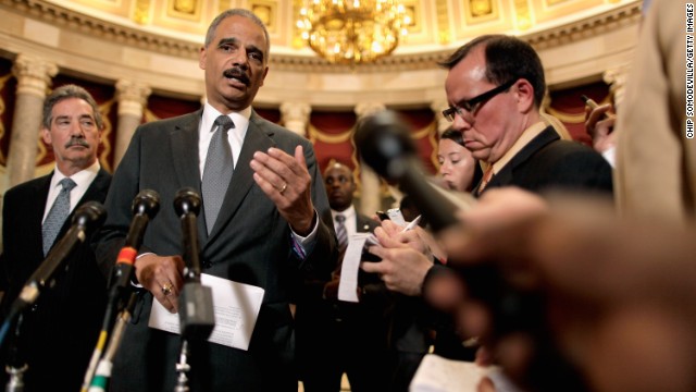 Holder talks to reporters after meeting with U.S. Rep. Darrell Issa, chairman of the House Oversight and Government Reform Committee, in June 2012. Issa and Holder met to discuss releasing documents related to the botched <a href='http://ift.tt/1wv4LPx'>Fast and Furious</a> investigation.