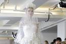 A model wears a creation from the Oscar de la Renta Bridal Spring 2016 collection, Saturday, April 18, 2015, in New York. (AP Photo/Mary Altaffer)