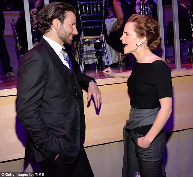 Catching up: Bradley Cooper was seen chatting away with Emma Watson as they celebrated the achievement