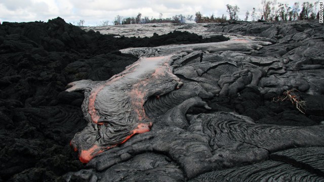 Lava flows from the Kilauea volcano October 3 in Pahoa, Hawaii. The flow has recently picked up speed, prompting emergency officials to close part of the main road through town and tell residents to be prepared to evacuate.