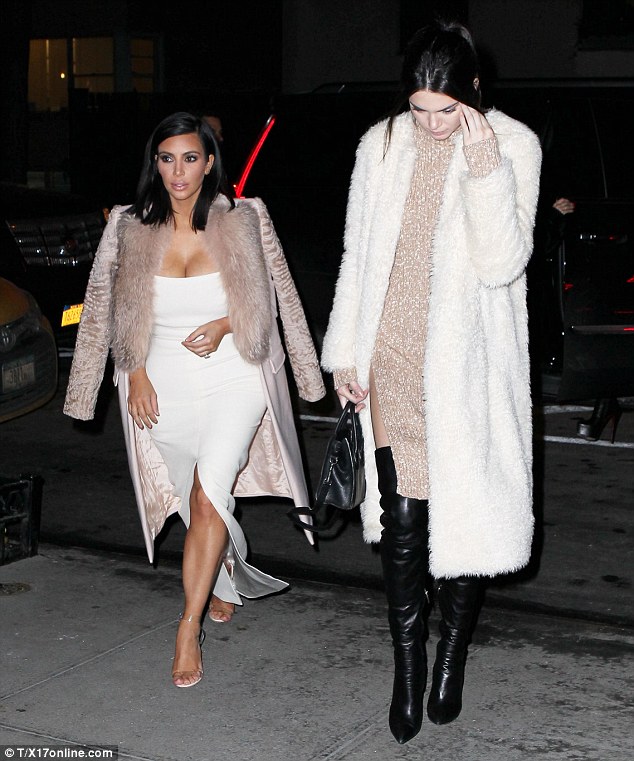 Tall genes: Walking next to her willowy sibling must make 5 ft 3 Kim realise her own shortcomings