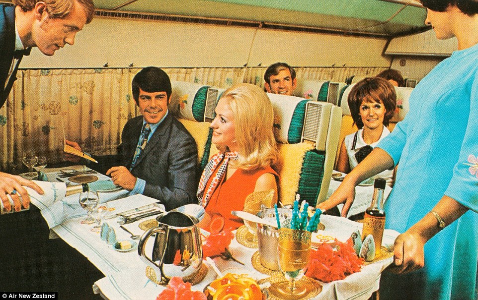 Passengers enjoy first class service on board one of Air New Zealand's flights in the 1960s; curtains cover the plane's windows