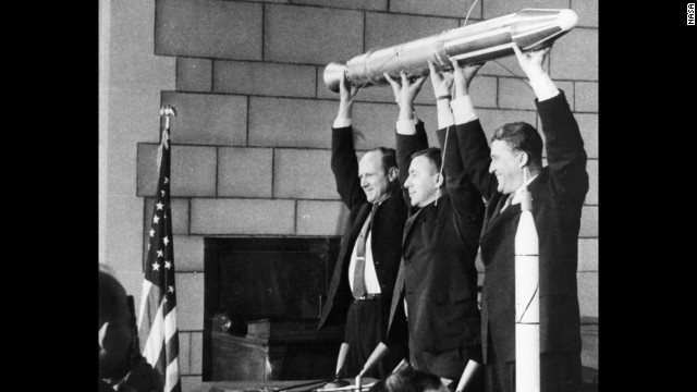 A model of Explorer 1, held by JPL's Director William Pickering, scientist James Van Allen and rocket pioneer Wernher von Braun (from left to right). The team was gathered at a news conference at the National Academy of Sciences in Washington to announce the satellite's successful launch. America's first satellite had been launched a few hours before, on January 31, 1958.