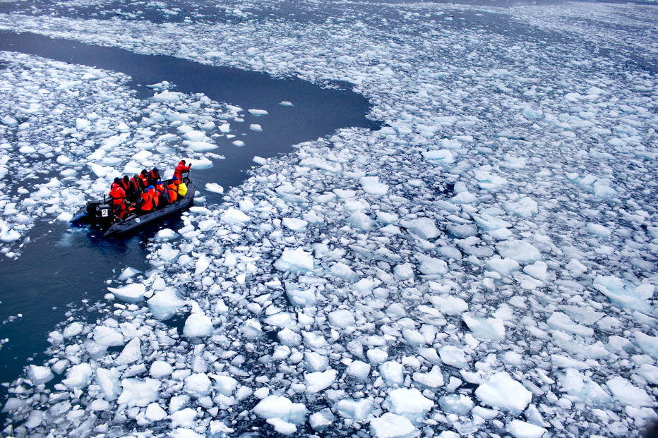 In this Jan. 22, 2015 photo, a zodiac carrying a team of international scientists heads to Chile's station Bernardo O'Higgins, Antarctica. Parts of Antarctica are melting so rapidly it has become “ground zero of global climate change without a doubt,” said Harvard geophysicist Jerry Mitrovica. 