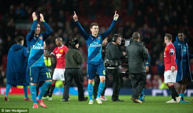 Arsenal duo Santi Cazorla (left) and Laurent Koscielny celebrate after the final whistle