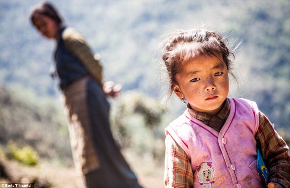 A mountain girl in a remote village in Nepal notices the camera is on her during Berta's hike to the area