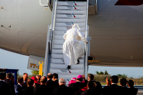 Pope Francis stumbled as he walked up the stairs  to board his flight to Philadelphia.