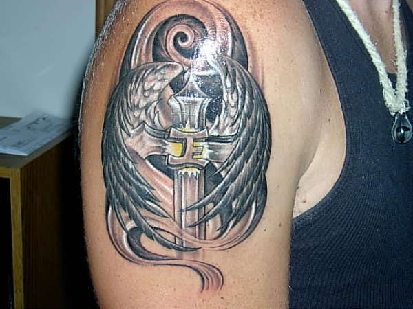 angel-wings tattoo on arm