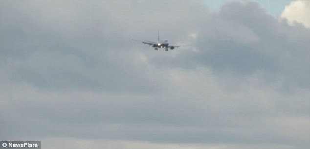 A 70-second video shot from the ground shows the plane wobbling as it was battered by powerful winds