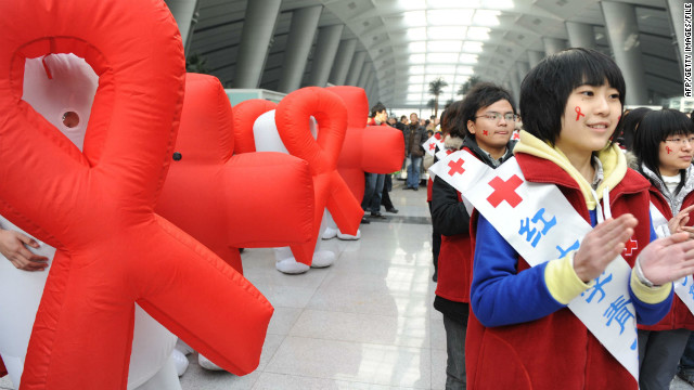 Volunteers from Red Cross China take part in an AIDS-awareness event on World AIDS Day in Beijing, December 1, 2009. 