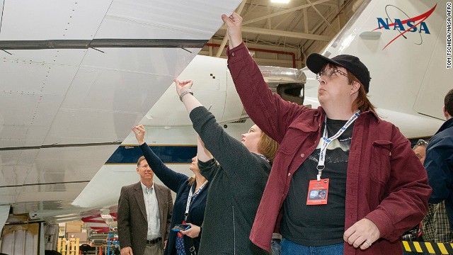 Attendee Trina Phillips (right) inspects an adaptive compliant trailing edge flap on a Gulfstream III flight research support aircraft.