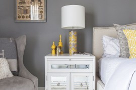 Gray bedroom with simple yellow accents