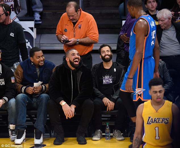 Busy holiday season: Drake has attended several NBA games courtside recently including this one on Wednesday as he is spotted chatting it up with NBA superstar Kevin Durant