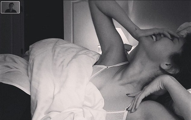 Seductive: On Sunday, Zedd posted an alluring photo of Selena Gomez lying in bed, wearing what appears to be lingerie, with the caption, '"Oh hi derrling..." - The Room #TheRoom #theRoom #THEroom #theROOM’