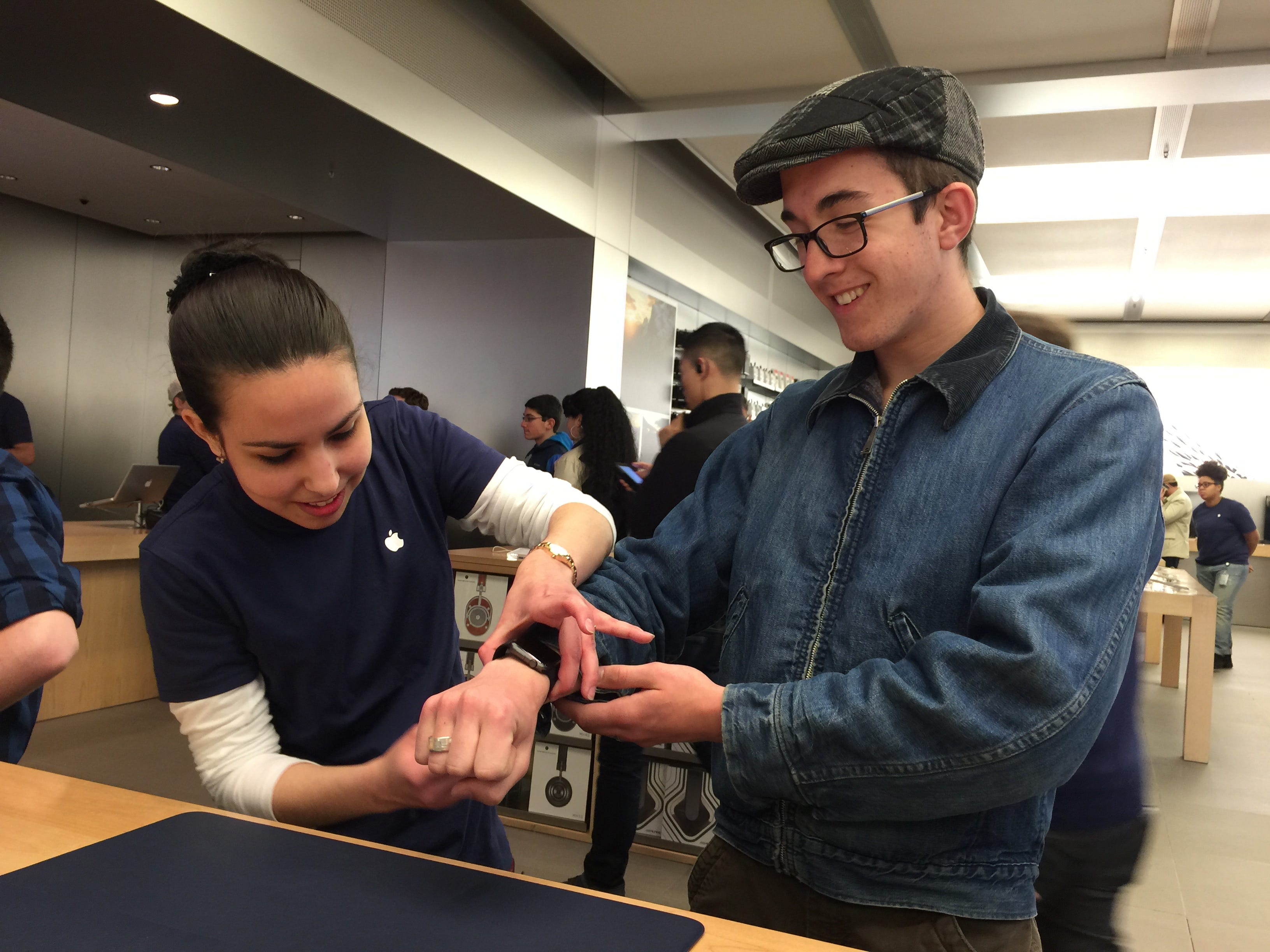 Apple store Apple Watch launch day customer trying on watch