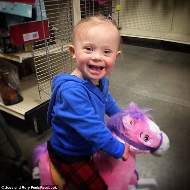 '...born to ride': Joey and Rory Feek shared an uplifting snap of their little girl Indiana playing with a pink toy horse on Friday 