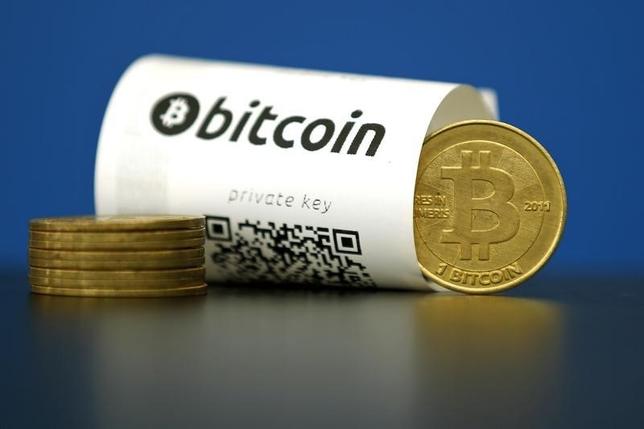 A Bitcoin (virtual currency) paper wallet with QR codes and a coin are seen in an illustration picture taken at La Maison du Bitcoin in Paris, France, May 27, 2015. REUTERS/Benoit Tessier